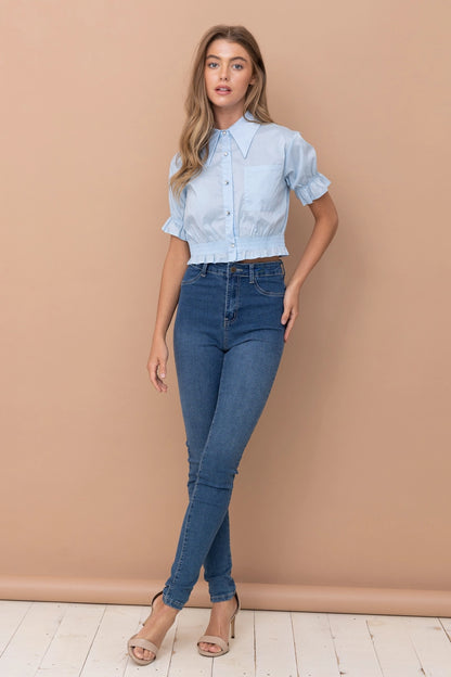 Cropped collared blouse Ruffled hem and sleeves Button up closure