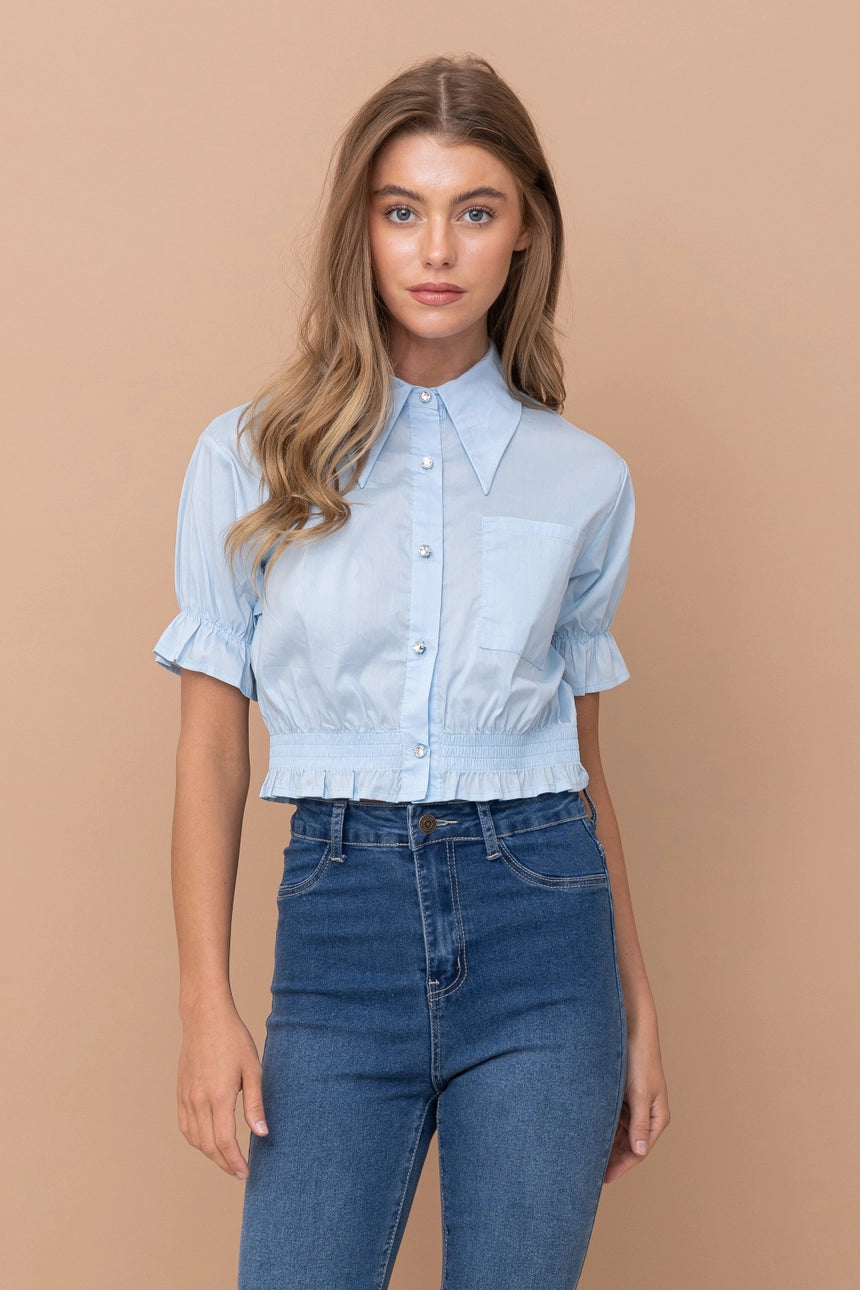 Cropped collared blouse Ruffled hem and sleeves Button up closure