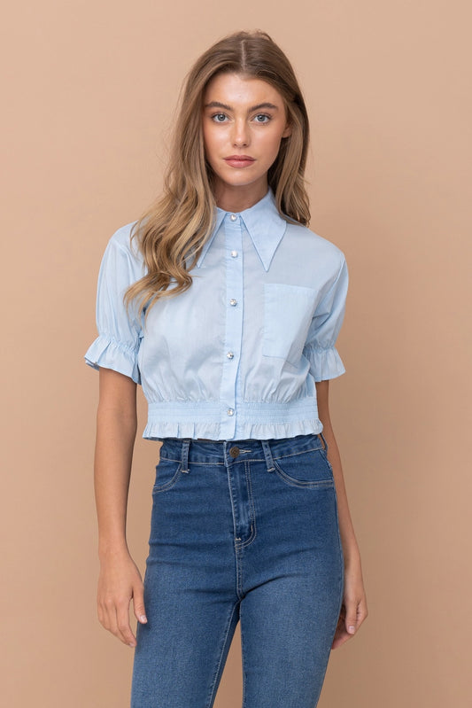 Cropped collared blouse Ruffled hem and sleeves Button up closure
